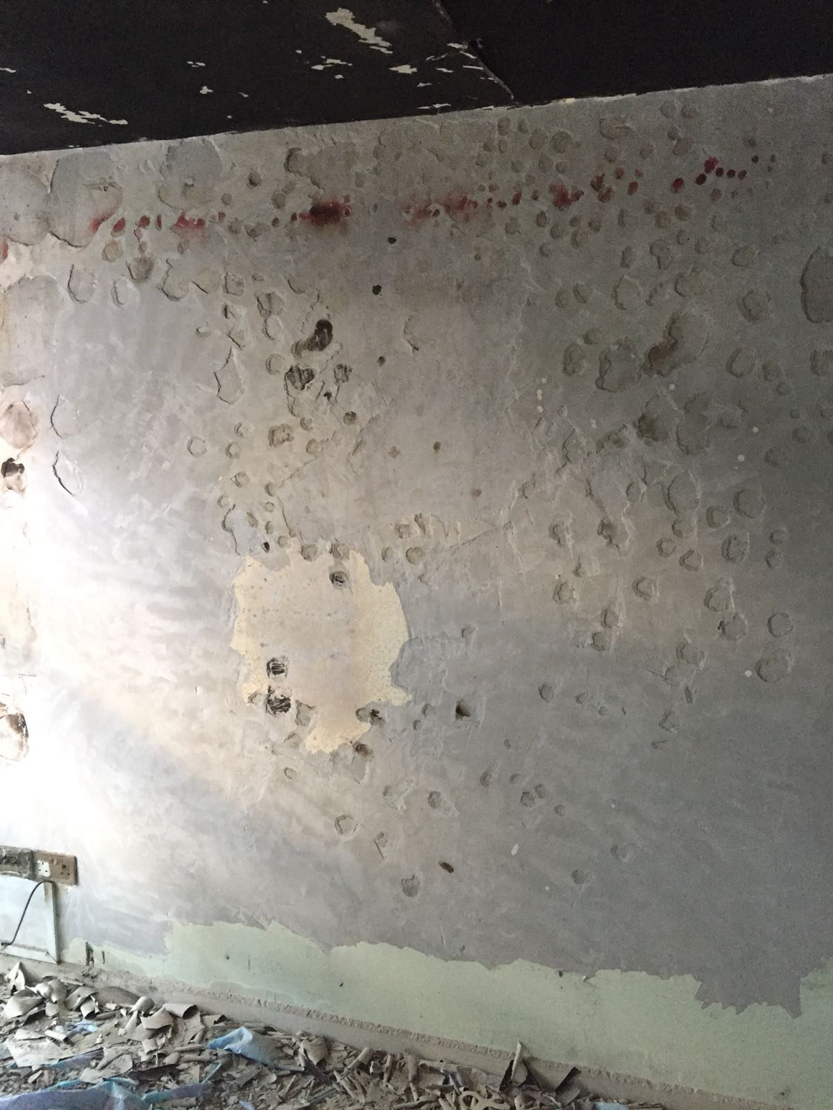 Technician applying surface coating treatment to a commercial interior surface