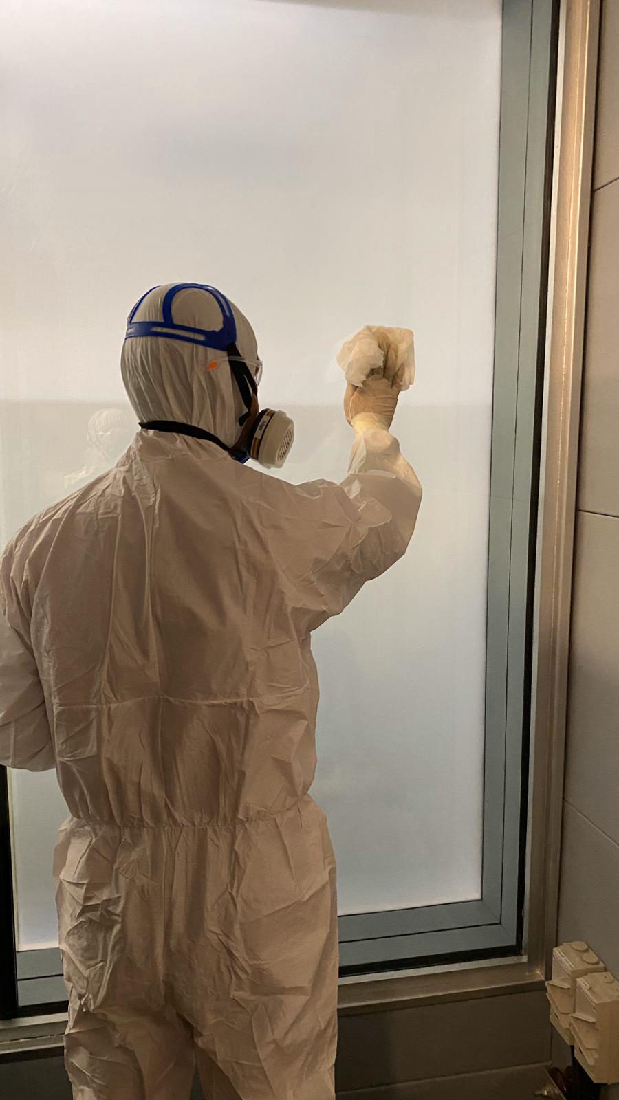 Close-up of a clinic door handle, a high-touch surface treated with antimicrobial coating