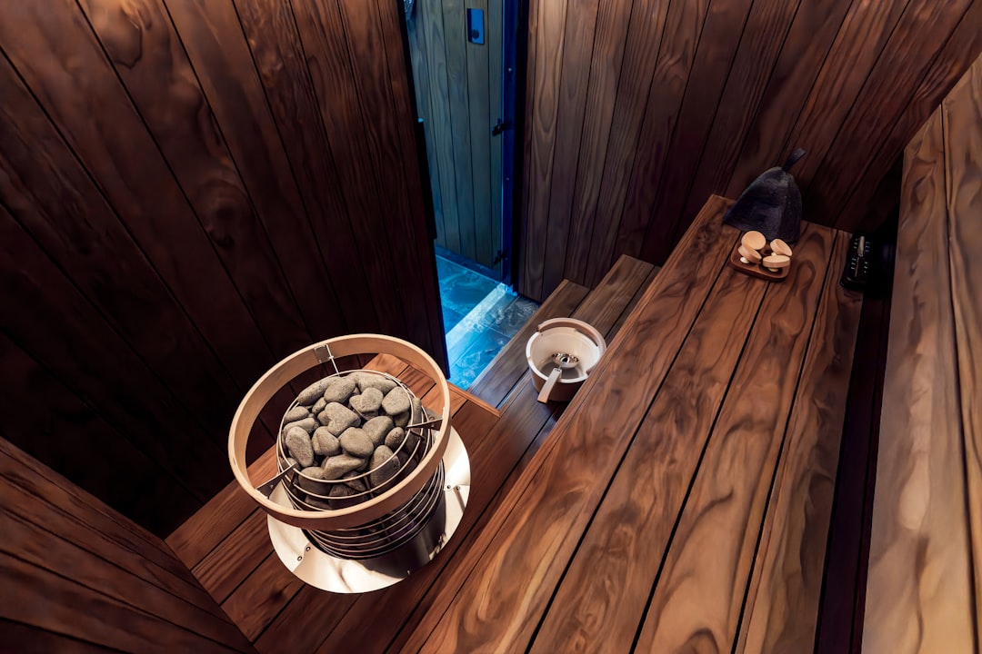 Traditional wooden sauna with hot stones and ladle